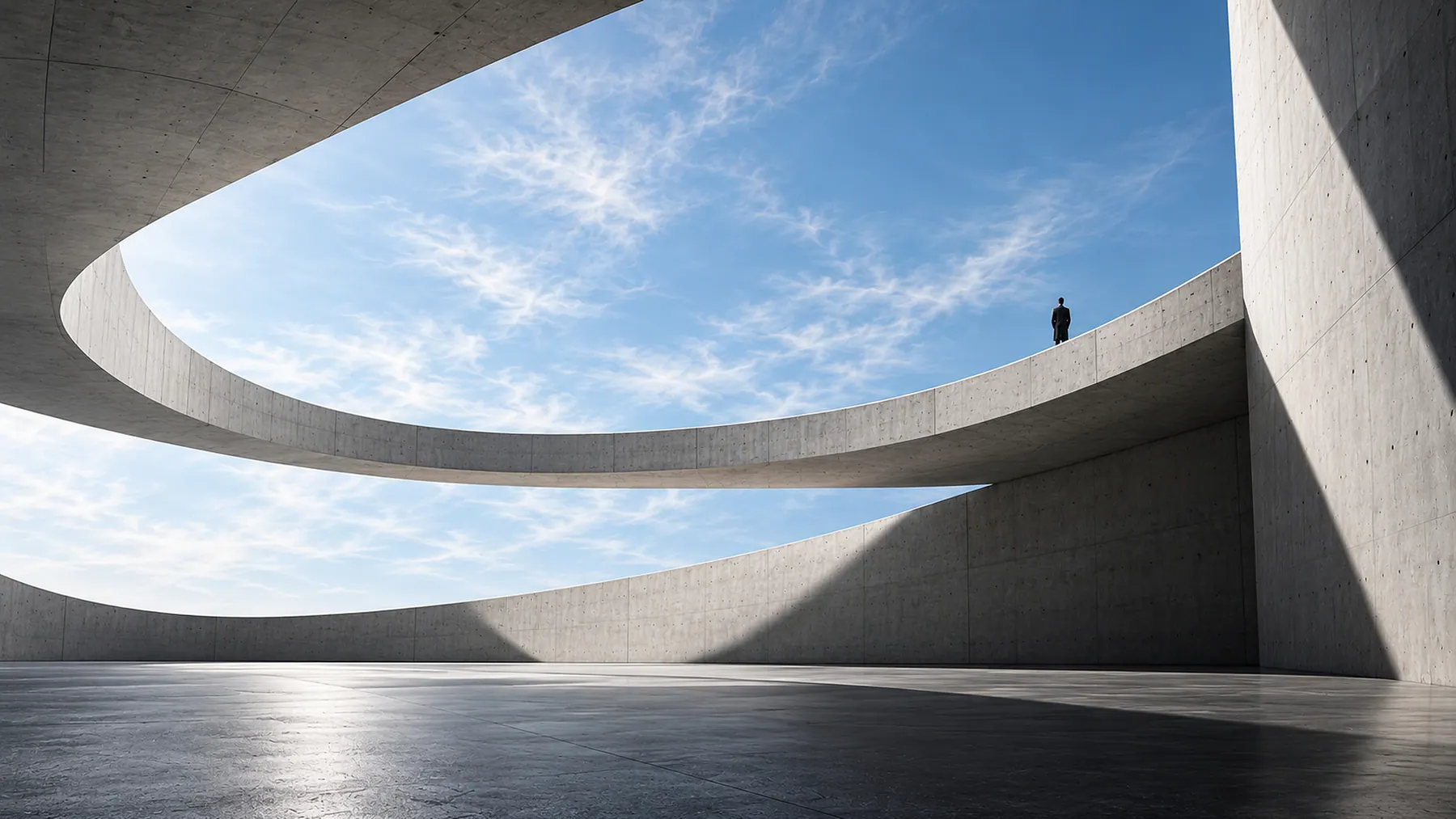 Layered concrete forms framing open sky